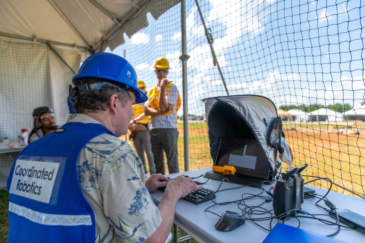 Team member managing their OCU and platforms from the staging area during a practice run