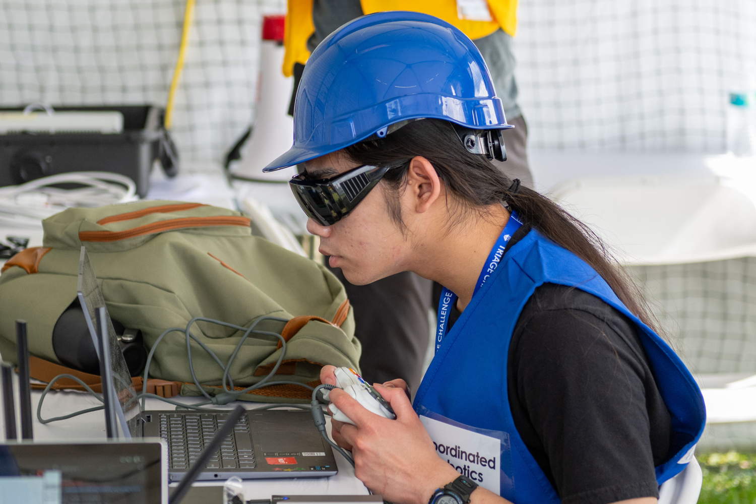 Coordinated Robotics team member intently staring at computer screen during exercise