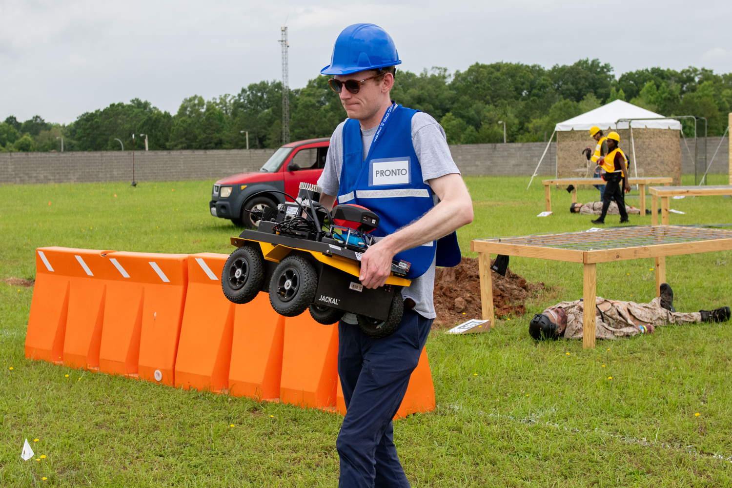 PRONTO team member preparing for course with UGV