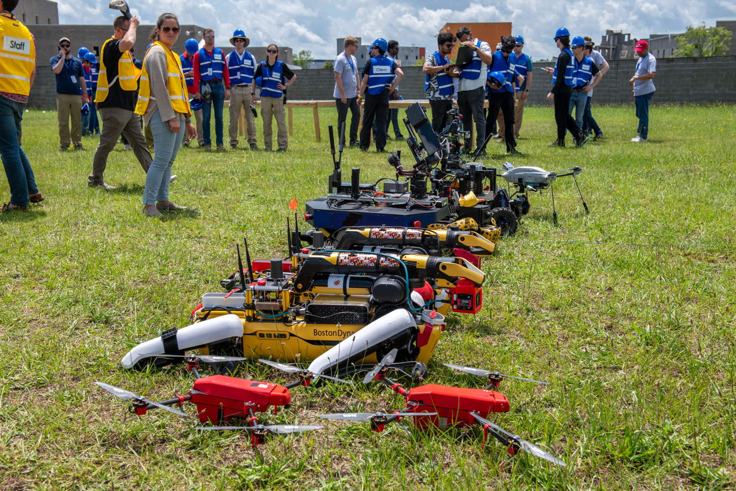 Row of UGVs and UAVs ahead of team photo